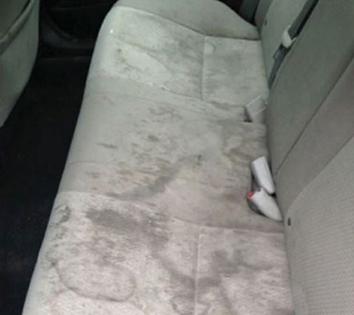 Before: stained grey fabric rear seat