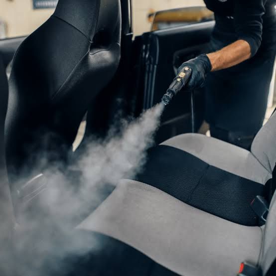 Steam cleaning cloth car seats to remove embedded odor