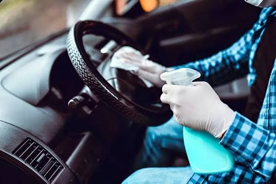 Sanitizing a steering wheel during interior odor treatment